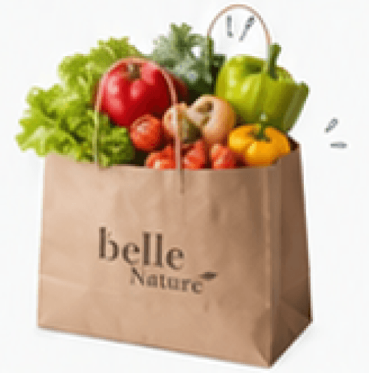 Belle Nature paper grocery bag overflowing with fresh vegetables — lettuce, tomatoes, peppers and herbs